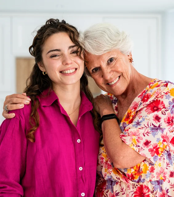 Two smiling women came to dental office in Phoenix after undergoing full mouth rehabilitation.