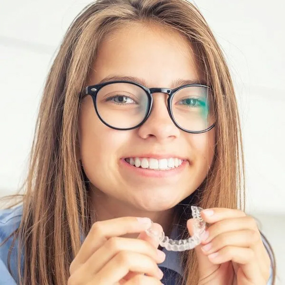 invisalign aligners showing teen girl